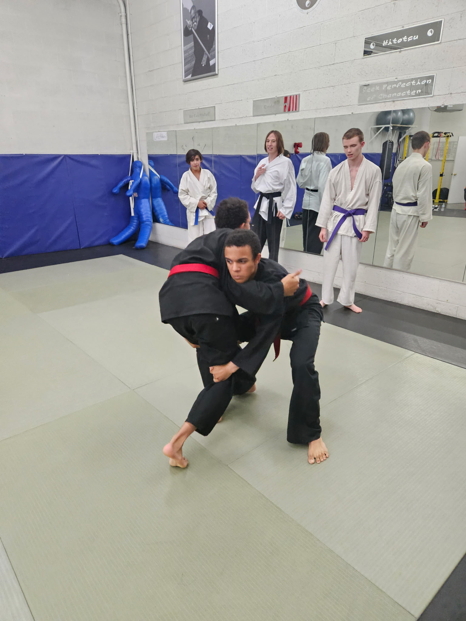 Black belt instructor demonstrating a takedown at Prescott Family Karate